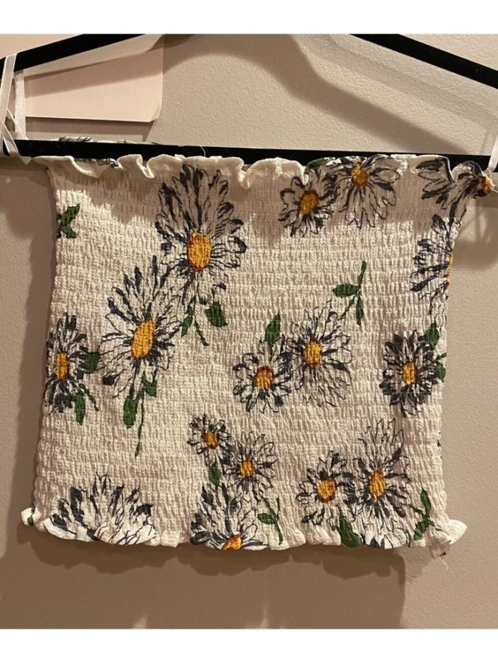 Top with straps for hangars